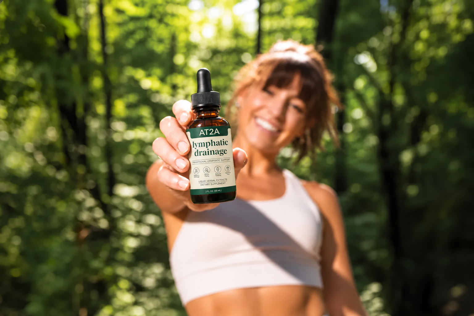 Woman holding AT2A drops outdoors